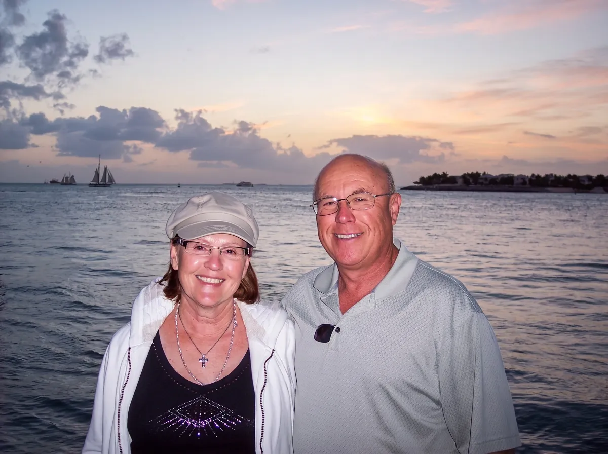 Duane and his wife at sunset on the water